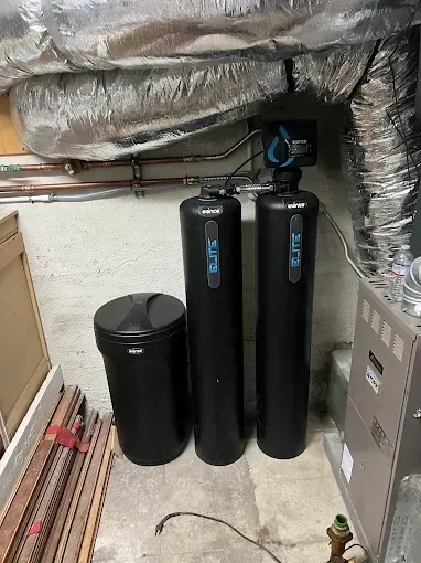 Whole-house water treatment tanks and connected pipework